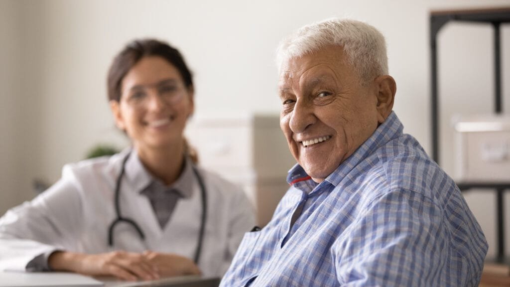 Smiling man during appointment at doctor's office.